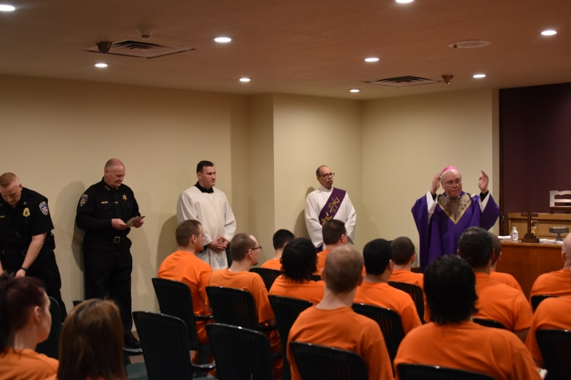 Malone Celebrates Mass with Holding Center Inmates Sheriff